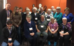 A group of co-op members sit together at an education event