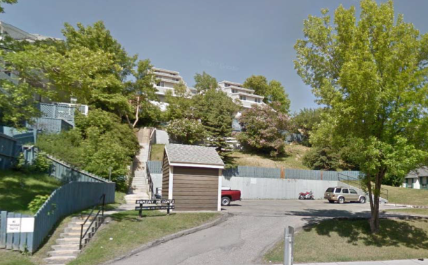 A photo shows a co-op built into a steep hill, with stairs leading upwards