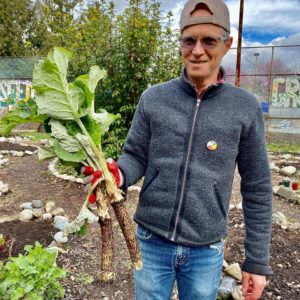 Ian holds a handful of freshly picked burdock